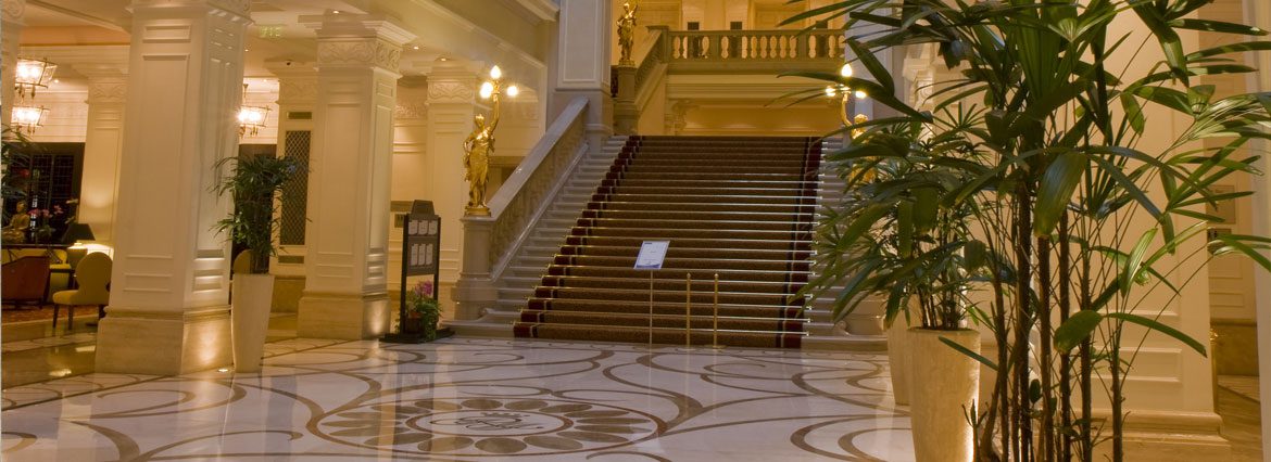 A large staircase with marble steps and an ornate design.