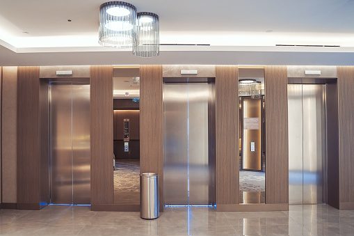 A lobby with stainless steel walls and floors.